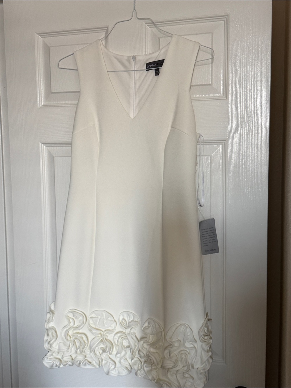 Donna Ricco Ivory V-Neck Mini Dress with Rosette Hem